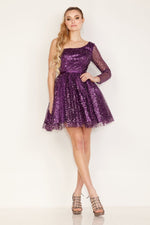 This dress features a long one-sleeve neckline, an A-line silhouette, tulle fabric with sequin and beads throughout. This dress brings the perfect amount of glam. Choose this style for your next homecoming or formal event.  CAC 2831