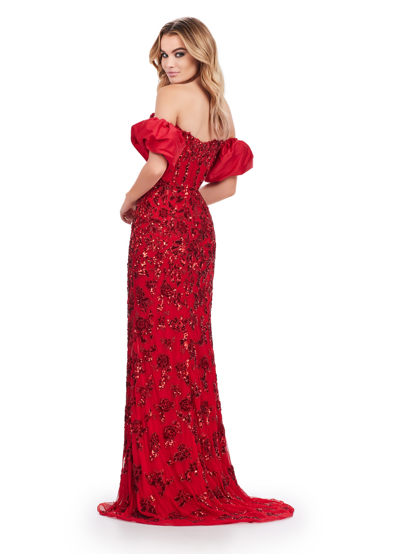 This fully beaded strapless gown features an intricate lace pattern and off-the-shoulder detachable taffeta puff sleeves. The neckline has a sweetheart illusion deep plunge, and the fitted silhouette has a slit in the skirt. Choose this unique design for your next pageant, prom or formal event!  Ashley Lauren 11585