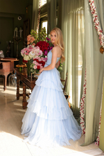 This enchanting ballgown features a one-shoulder design with a delicate ruched bodice, cascading into a layered ruffle skirt. Style this dress to make it your own at your next prom or formal event!&nbsp;

ARY 29131