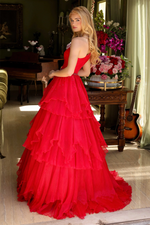 This enchanting ballgown features a one-shoulder design with a delicate ruched bodice, cascading into a layered ruffle skirt. Style this dress to make it your own at your next prom or formal event!&nbsp;

ARY 29131