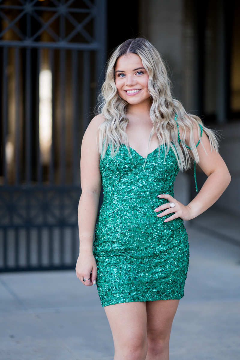 Glam up your next homecoming dance in Kendelyn! This glittery sequin dress features a lace-up back to show off just the right amount of your glittery self. Feel sparkly and shine radiantly at your next homecoming, sweethearts or formal event.  Ashley Lauren 4625
