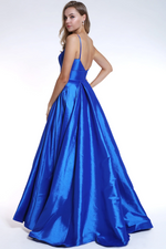 This simple long gown features a straight neckline with delicate straps and a high slit. The soft taffeta material of this dress makes it perfect to dance the night away in at prom.  ARY 35738