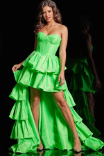 This dress features a strapless sweetheart neckline with a corset bodice with boning, a high-low hemline and an A-line silhouette. The skirt has tiered layers all in a taffeta fabric. This dress is fun and fresh and could be just the dream dress for your next prom or formal event.  Jovani 36983A