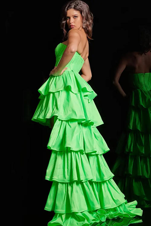 This dress features a strapless sweetheart neckline with a corset bodice with boning, a high-low hemline and an A-line silhouette. The skirt has tiered layers all in a taffeta fabric. This dress is fun and fresh and could be just the dream dress for your next prom or formal event.  Jovani 36983A