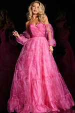 Crafted from organza, this dress boasts a lightweight and textured print fabric that adds depth and sophistication to the dress. This dress also features an A-line silhouette, a sweetheart neckline with a ruched bodice, and removable puff sleeves. Choose this feminine and playful gown for your next prom or formal event.  Jovani 38605A