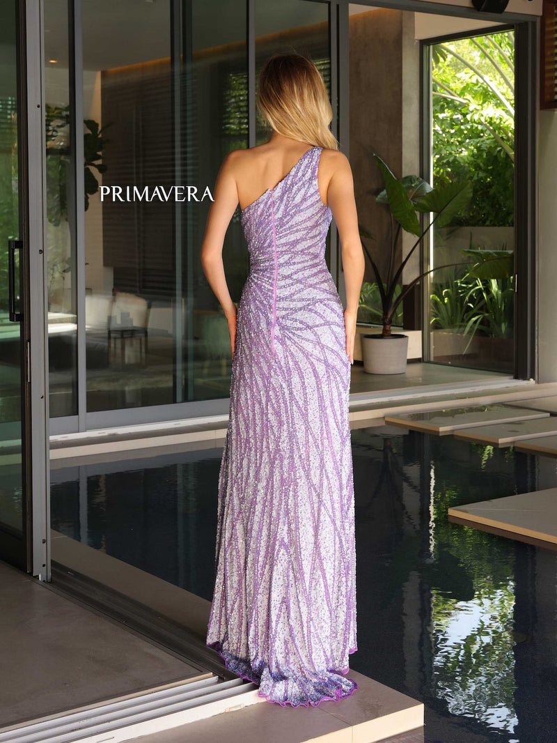 This dress features a one-shoulder neckline with a fitted silhouette and sequin and bead embellished fabric. This dress has a slit and a slight train. It is glamorous and could be styled to make it your own at your next prom or formal event.  PV 4133