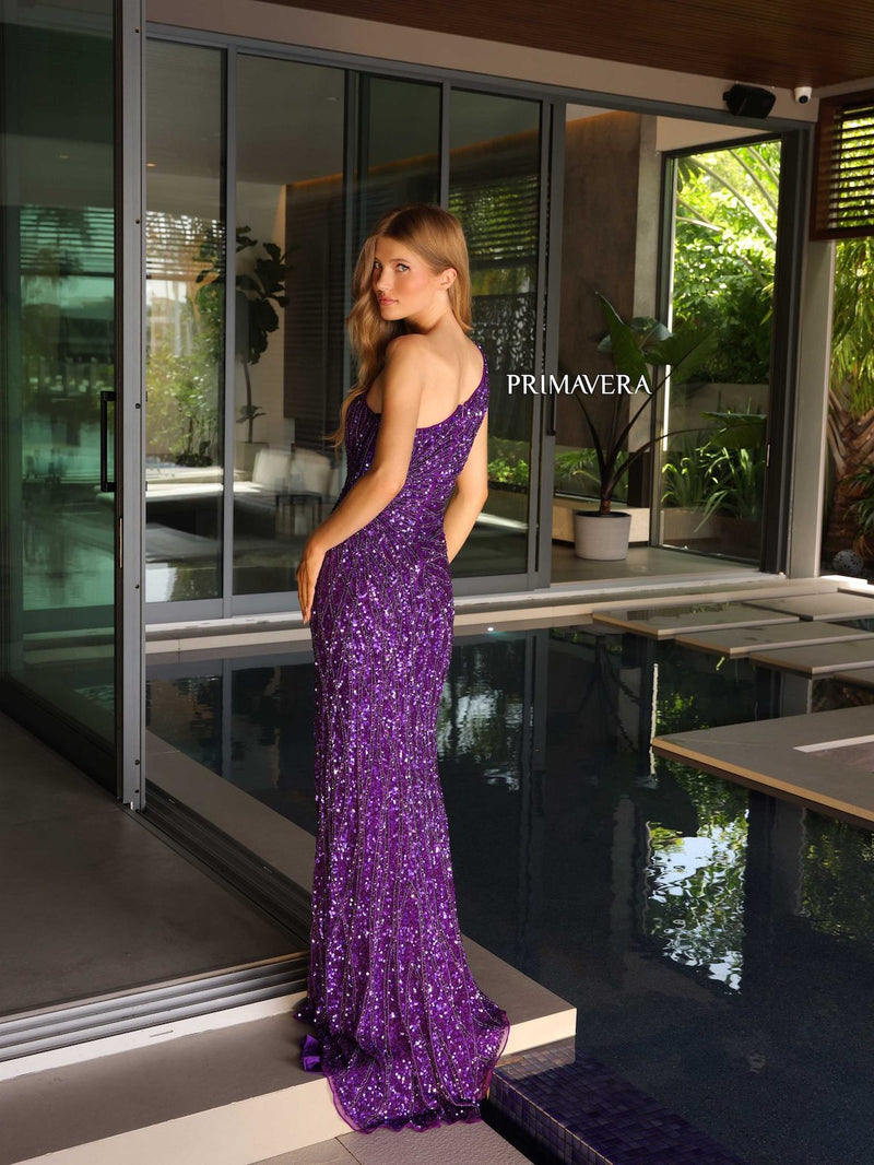 This dress features a one-shoulder neckline with a fitted silhouette and sequin and bead embellished fabric. This dress has a slit and a slight train. It is glamorous and could be styled to make it your own at your next prom or formal event.  PV 4133