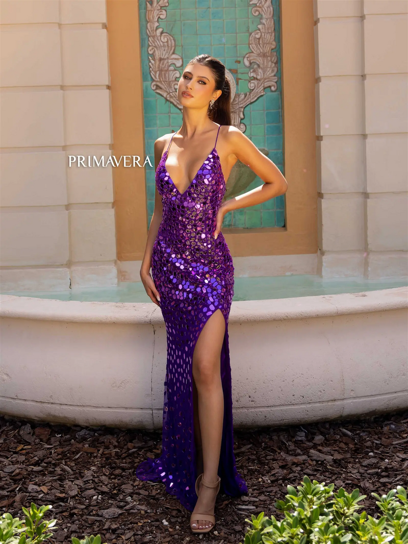 This dress features a v-neckline with spaghetti straps and an open lace-up back. This gown features cut glass beads throughout with a fitted silhouette and a slit. It is fashion forward and unique and could be just the vibe for your next prom or formal event.   PV 4151