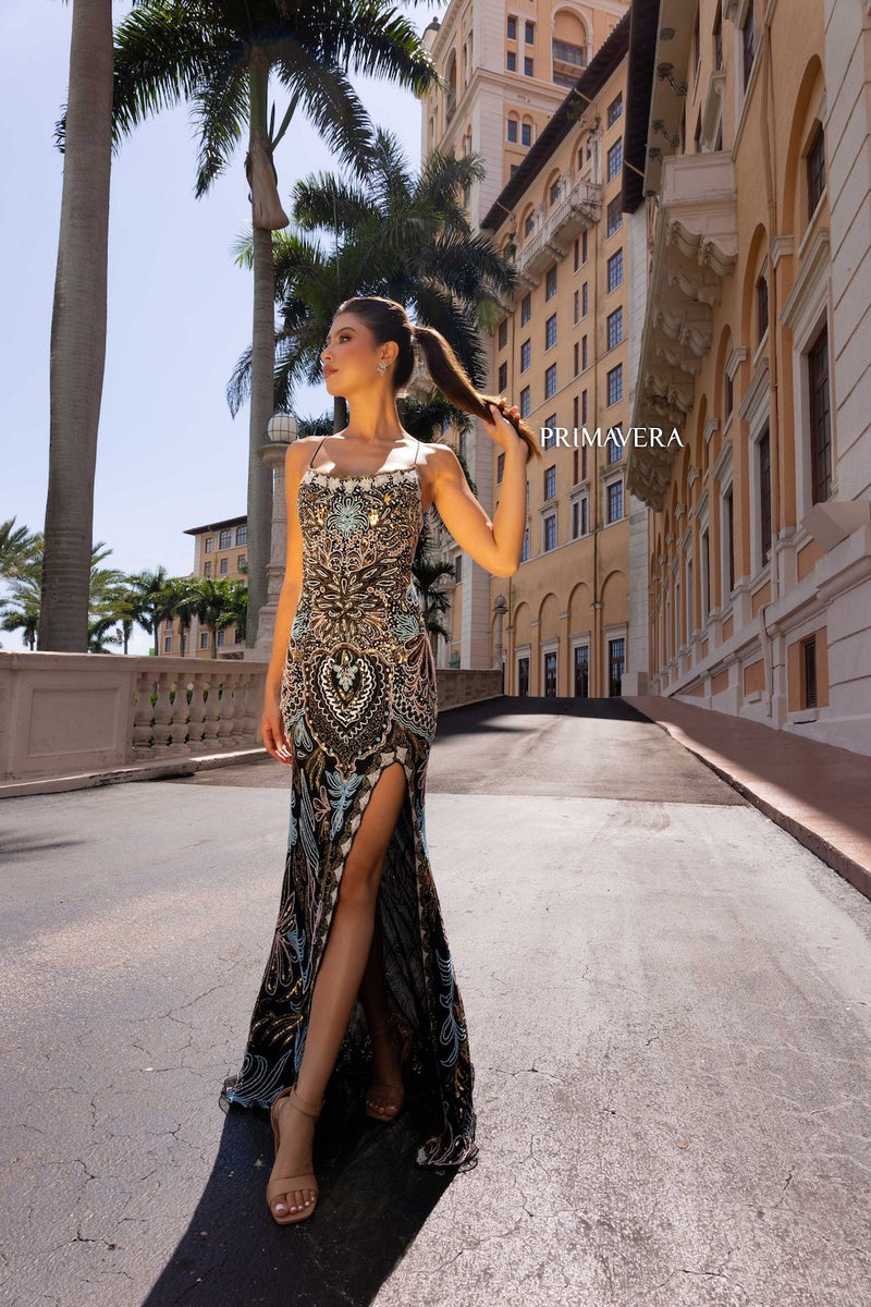 This dress features a fully beaded and sequined dress, intricately designed in a unique pattern. This gown has a fitted silhouette and a lace-up back and side slit. This is a stunning choice for your next prom or formal event.   PV 4156