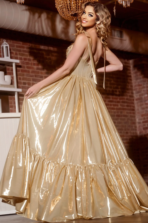 This dress features a sweetheart neckline with spaghetti straps. The bodice has corset boning and a cutout with a flowy skirt all in a metallic shimmer fabric. This gown is romantic and could be perfect for your next prom or formal event.

Jovani 43596A
