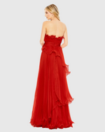 Designed in solid chiffon, this dress focuses on luxe texture—pleats and structured ruffles. The strapless neckline pairs perfectly with a faux waist sash and a Grecian-inspired asymmetrical, tiered skirt. Stun at your next prom or formal event in this stunning gown.

Mac Duggal 49537