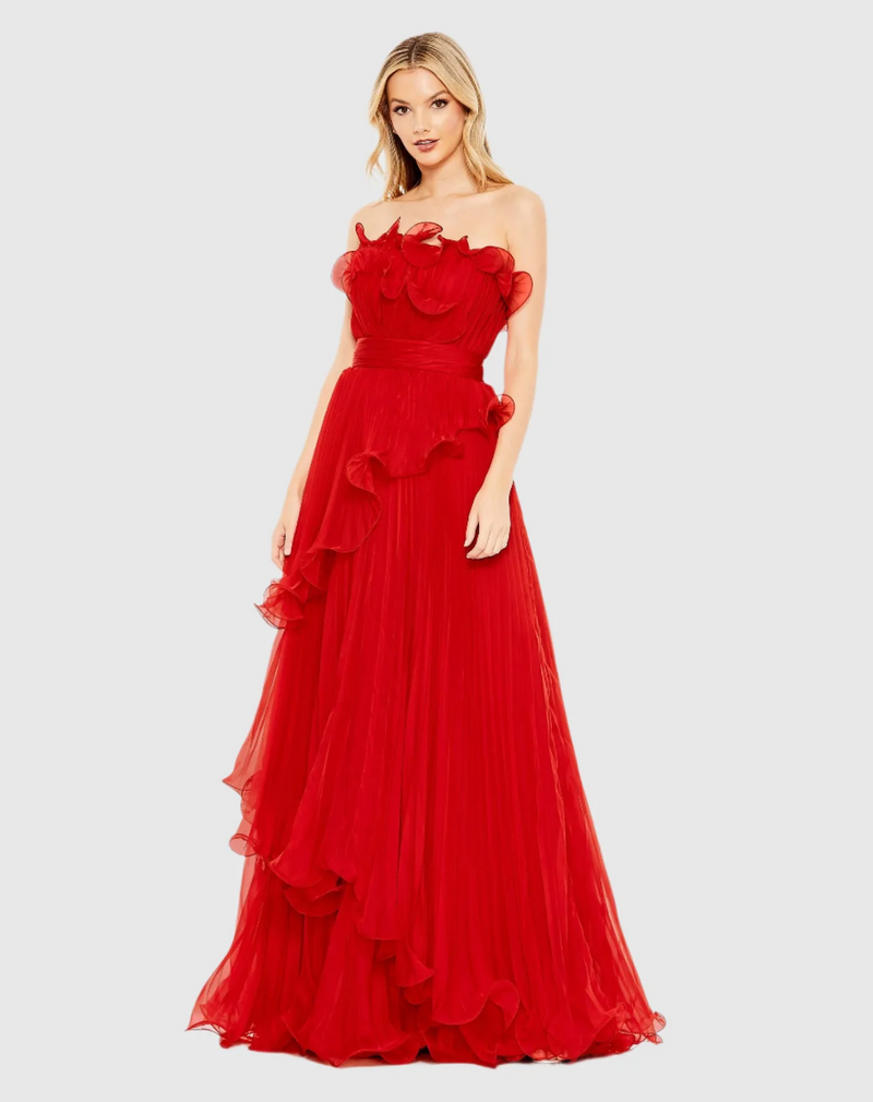 Designed in solid chiffon, this dress focuses on luxe texture—pleats and structured ruffles. The strapless neckline pairs perfectly with a faux waist sash and a Grecian-inspired asymmetrical, tiered skirt. Stun at your next prom or formal event in this stunning gown.

Mac Duggal 49537