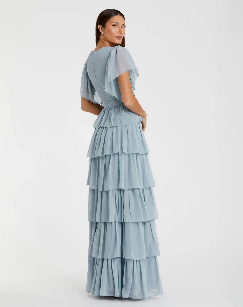 This dress features a V-neckline, short flutter sleeves, and a ruffle tiered skirt. This dress has boho vibes and could be styled to make it your own at your next prom or formal event!

Mac Duggal 49595