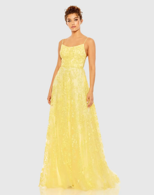 This floral applique A-line gown features an embellished tulle overlay and a scoop neckline with beaded spaghetti straps. Hand-stitched beading enhances the allover floral applique, creating a stunning A-line silhouette. Perfect for prom or any formal event.

Mac Duggal 50683
