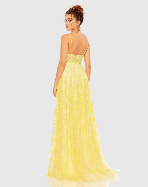 This floral applique A-line gown features an embellished tulle overlay and a scoop neckline with beaded spaghetti straps. Hand-stitched beading enhances the allover floral applique, creating a stunning A-line silhouette. Perfect for prom or any formal event.

Mac Duggal 50683