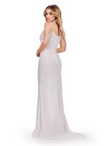 This dress features a fully beaded fabric encrusted with pearls and crystals. This dress features an off-the-shoulder design and a fully beaded matching choker. The fitted silhouette offers a slit and a train to follow. Stun at your next prom, pageant or formal event in this stunning gown.  Ashley Lauren 11598