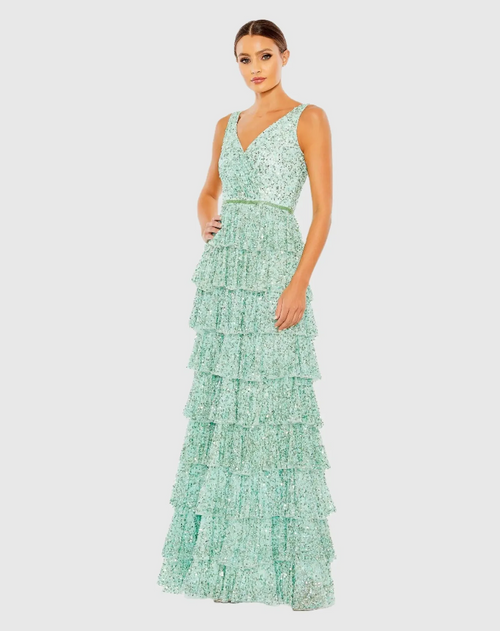 Crafted from sequin-embellished mesh, the gown is styled with a surplice bodice, sleeveless shoulders, and a tiered A-line skirt with just enough volume. A slim, beaded waistband offers a dazzling touch and unites fitted top and ruffled bottom. This dress could be ideal for your next prom or formal event.

Mac Duggal 5627