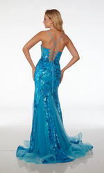 This dress features a plunging illusion neckline, a slight mermaid silhouette, a lace-up back, a slit, and a train. This dress is fully sequined that are laid in a floral pattern. This dress is radiant and could be just the vibe for your next prom or formal event.  Alyce 61617