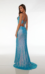This dress features a scoop cowl neckline with dual adjustable spaghetti straps, a criss-cross lace-up back, vibrant sequin fabric fabric, and a train. This dress has all the details to wow at your next prom or formal event.  Alyce 61626