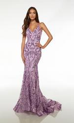 This gown features a V-neckline with an open lace-up back, spaghetti straps, a fitted silhouette, sequin embellished fabric and a train. This gown is regal and glamorous and could be styled to make it your own at your next prom or formal event.  Alyce 61659