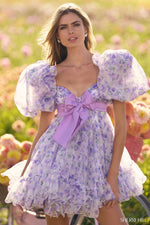 This cocktail dress features organza floral print fabric, with a baby doll silhouette with ruffle embellishments, a taffeta bow and balloon sleeves. This is a fun and playful choice for your next homecoming or formal event.

Sherri Hill 56383