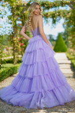 This dress features a strapless neckline with a keyhole, and rosette embellishment in the bodice. The sparkle tulle fabric with a ruffle skirt creates a fairytale vibe for this stunning gown.&nbsp;

Sherri Hill 56884