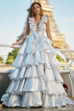 This dress features a deep V-neckline with a ruffle embellished collar, a layered tiered skirt creating an A-line silhouette. The open back compliments the volume of this dramatic gown. This dress may be ideal for your next prom or formal event.

Sherri Hill 56802