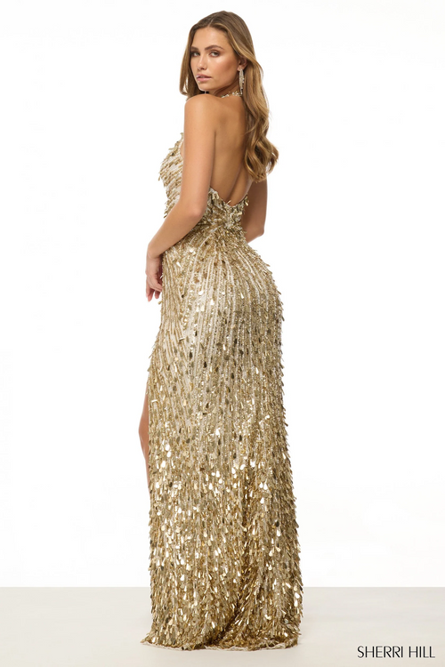 This gown features fully beaded fabric, a halter neckline with a deep V, a skirt slit, and an open back. Stun at your next prom or pageant in this gorgeous dress.

Sherri Hill 57227