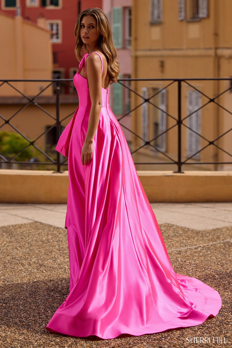 This stretch A-Line gown features a sweetheart neckline, bow straps and high slit. This fabric flows effortlessly and with the mini-train, creates a dramatic effect. Style this dress to make it your own at your next prom or formal event!

Sherri Hill 57056