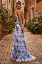 This dress features a strapless neckline with a beaded floral blue print fabric, a lace-up back, and a tulle ruffle skirt with a slit. The mermaid silhouette and intricate fabric make this dress truly special and perfect for your next prom or formal event.

Sherri Hill 57114