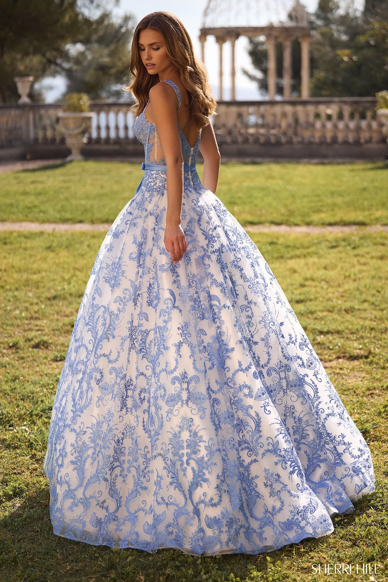 This dress features a floral embroidered bodice with corset boning, a voluminous skirt creating an A-line silhouette in this intricate ivory and blue fabric. Stun at your next prom or formal event in this gorgeous ballgown.

Sherri Hill 57058