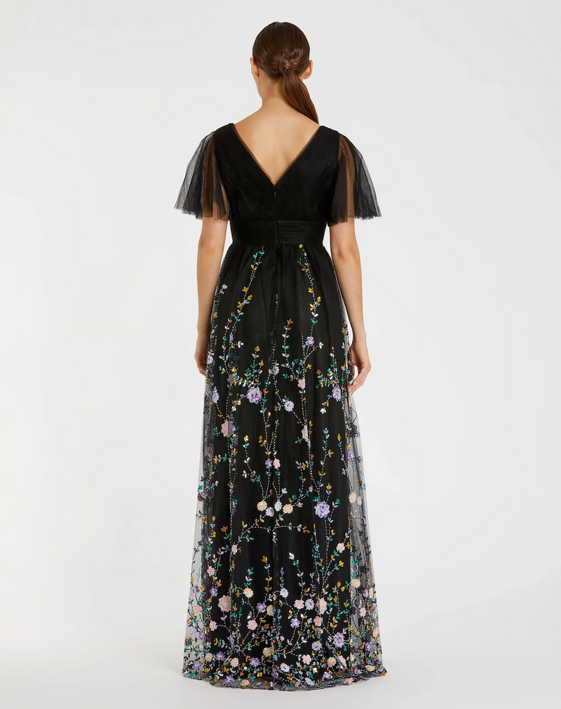 This dress features an embroidered butterfly sleeve with an empire waist. Delicate embroidery adds a touch of whimsy to this timeless silhouette. Style this dress to make it your own at your next prom or formal event.

Mac Duggal 67889
