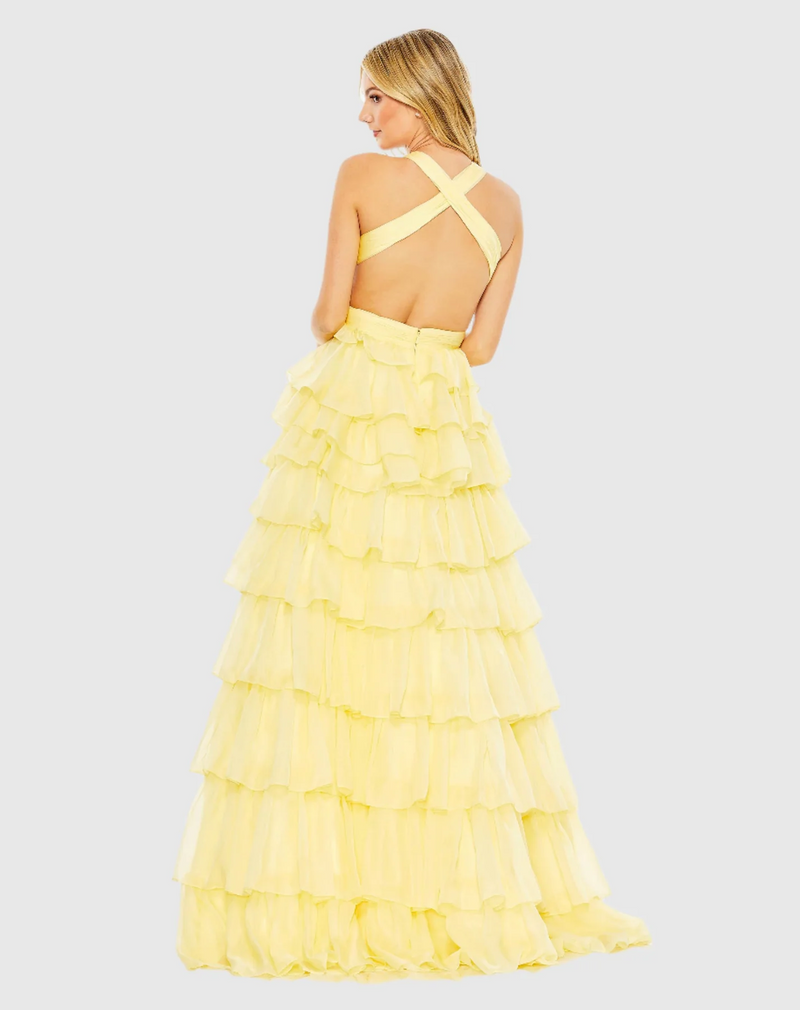 This bold prom dress is styled with a pleated bodice with a deep neckline, waist cutouts, and criss-cross center. Layers of graduated ruffles fill out the full skirt for a design that’s dramatic. Stun at your next prom or formal event in this unique ballgown.

Mac Duggal 67988