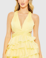This bold prom dress is styled with a pleated bodice with a deep neckline, waist cutouts, and criss-cross center. Layers of graduated ruffles fill out the full skirt for a design that’s dramatic. Stun at your next prom or formal event in this unique ballgown.

Mac Duggal 67988