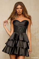 This strapless cocktail dress features a lace corset bodice with a strapless sweetheart neckline and a tiered ruffle skirt. This dress is glamorous and could be perfect for your next homecoming or formal event.

Sherri Hill 57449