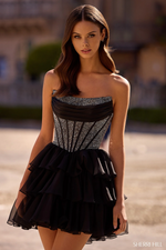 This cocktail dress features a strapless neckline with a hot fix corset bodice and a chiffon ruffle skirt and a lace-up back. This dress is glamorous and could be perfect for your next homecoming or formal event.

Sherri Hill 57404