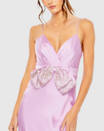 Crafted from luxurious satin fabric, this gown exudes effortless elegance. The eye-catching rhinestone-encrusted bow adds a touch of glamour with a fitted silhouette and spaghetti straps.

Mac Duggal 68144