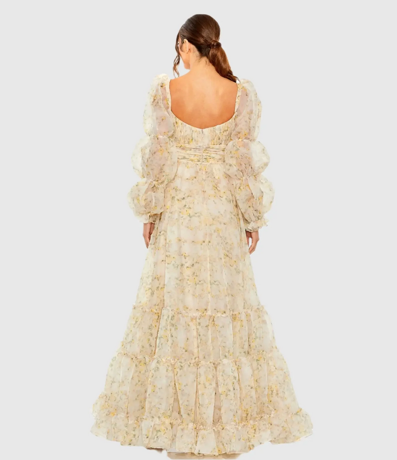 This dress features a floral-printed chiffon fabric that is fully lined through body with long puff sleeves, a pleated bodice and a ruffle tiered skirt. This boho dress could be ideal for your next prom or formal event.

Mac Duggal 68288
