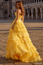 This strapless sweetheart ballgown features a silk corset bodice with a bow detail, a chiffon ruffle skirt, and a skirt slit. This dress is elegant and could be ideal for your next prom or formal event.

Sherri Hill 57586