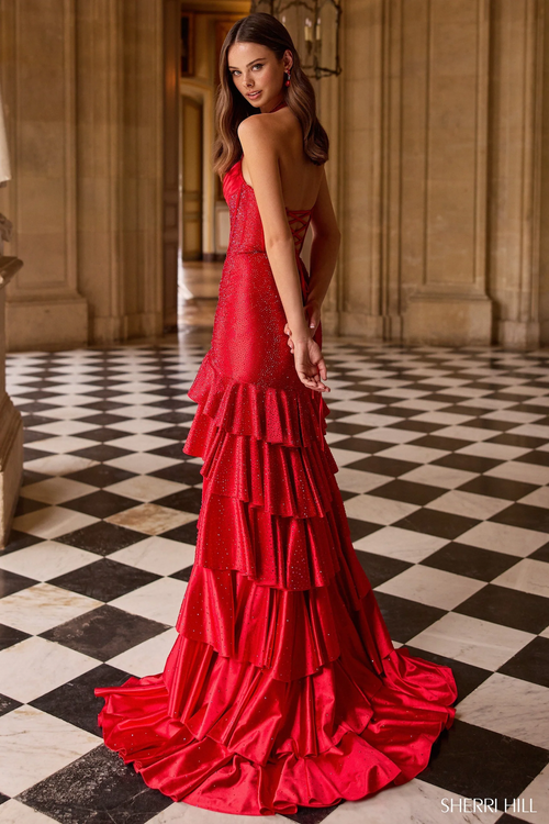 This dress features a halter neckline and a mermaid silhouette with hot fix stones, a corset bodice and a ruffle skirt. A stunning choice for your next prom or formal event.

Sherri Hill 57618