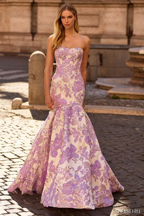 This dress features a strapless neckline, a mermaid silhouette and a brocade fabric. Style this dress to make it your own at your next prom or formal event.

Sherri Hill 57785