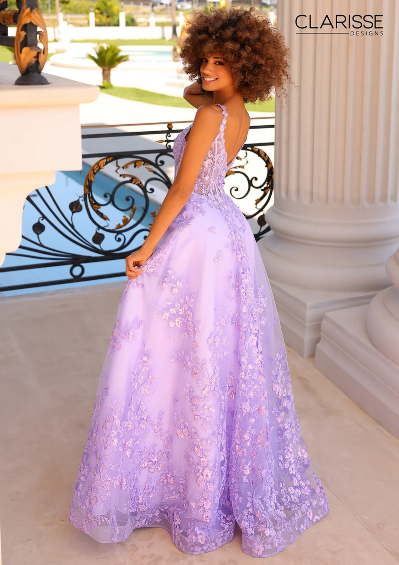 This beautiful A-line dress features an iridescent sequin floral applique, a sheer corset bodice, floral lace straps, and a zip-up back for a comfortable fit. Choose this stunning gown for your next prom or formal event.  CLE 810974