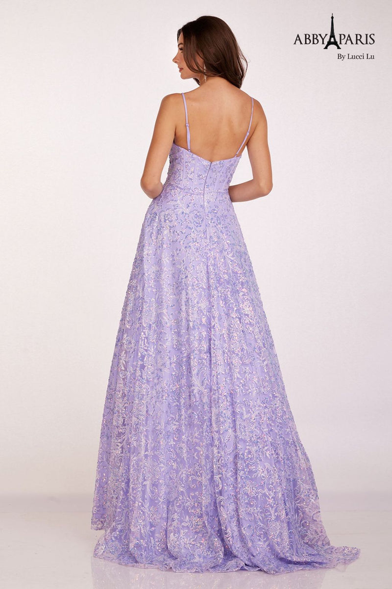 This dress features a straight across neckline with adjustable spaghetti straps. The bodice features corset boning with vibrant embroidered tulle fabric, pockets and an A-line silhouette. Style this dress to make it your own at your next prom or formal event.  LU 90233