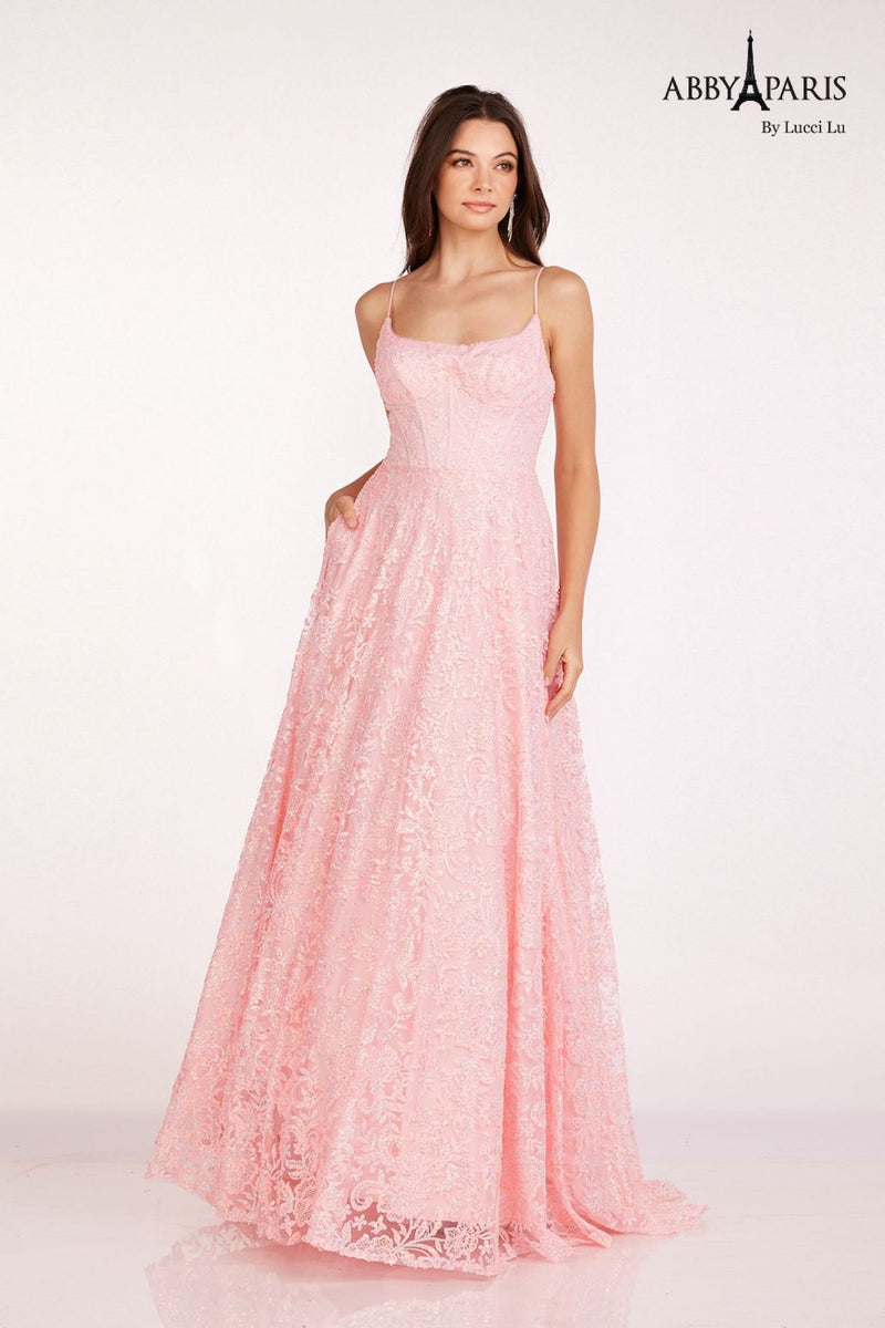 This dress features a straight across neckline with adjustable spaghetti straps. The bodice features corset boning with vibrant embroidered tulle fabric, pockets and an A-line silhouette. Style this dress to make it your own at your next prom or formal event.  LU 90233