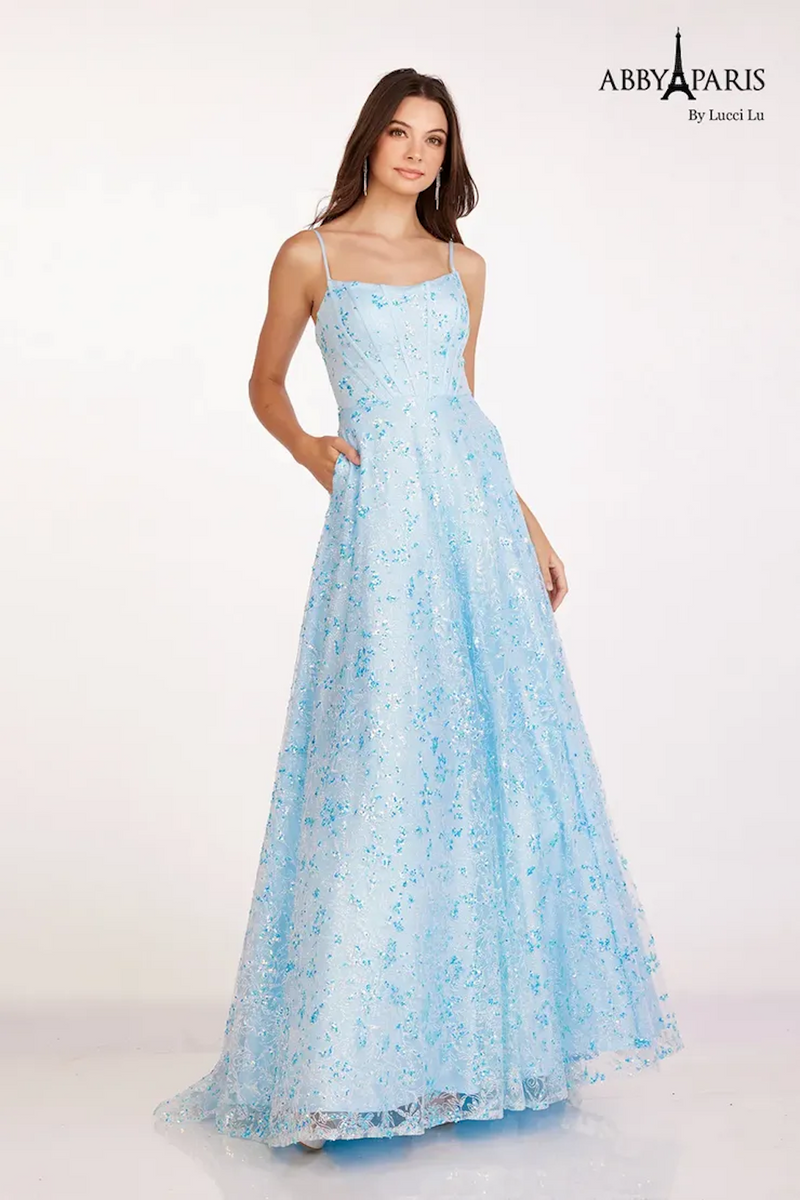 This dress features a straight across neckline with spaghetti straps, a bodice with corset boning, and an A-line silhouette. The fabric has lace and sequin detailing adding that elegance and a touch of glam. Stun at your next prom or formal event in this fairytale design.   LU 90240