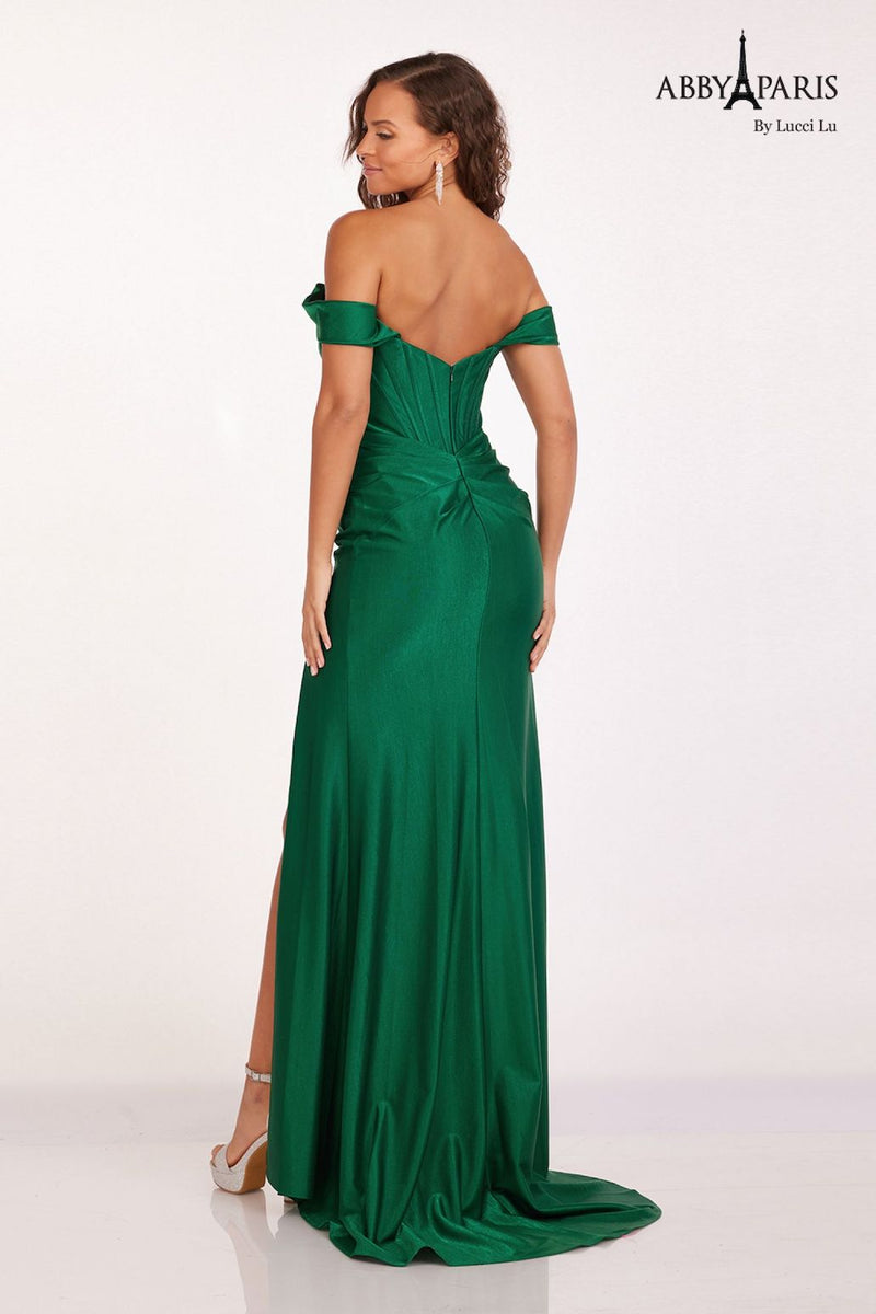 This dress features an off-the-shoulder neckline with a bodice with corset boning, a fitted silhouette and a slit. This dress is classic and elegant and ideal for your next prom or formal event.  LU 90252