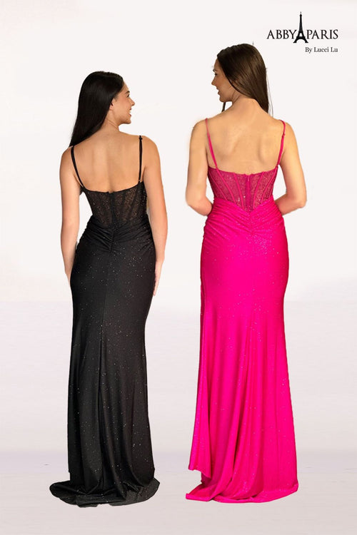 This dress features a sweetheart neckline with spaghetti straps and a sheer bodice with corset boning. The fabric is a shimmer knit paired with a fitted silhouette and a slit. This dress is a stunning option for your next prom or formal event.  LU 90263