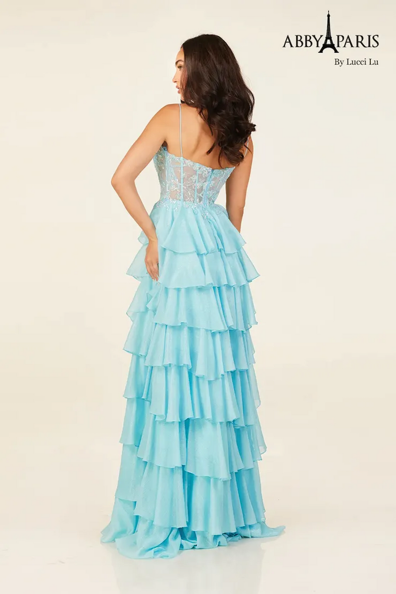 This dress features a boat neckline with spaghetti straps and a sheer bodice with corset boning. The skirt has layered tiers creating an A-line silhouette. This dress may be ideal for your next prom or formal event.

LU 90326