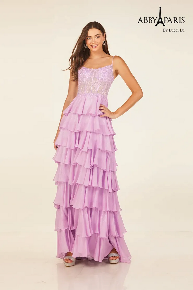 This dress features a boat neckline with spaghetti straps and a sheer bodice with corset boning. The skirt has layered tiers creating an A-line silhouette. This dress may be ideal for your next prom or formal event.

LU 90326