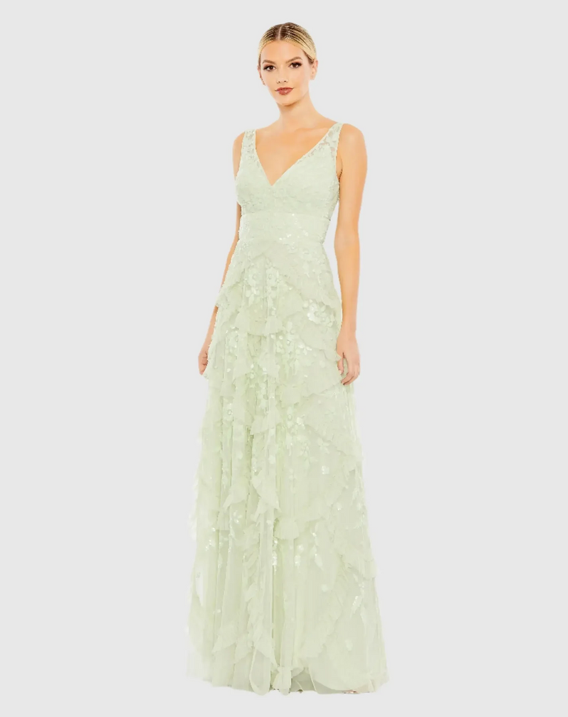 This gown showcases exquisite hand-sequined floral fabric paired with a scalloped, tiered ruffle skirt, seamlessly merging intricate craftsmanship with romantic elegance. Style this dress to make it your own at your next prom or formal event.

Mac Duggal 9162